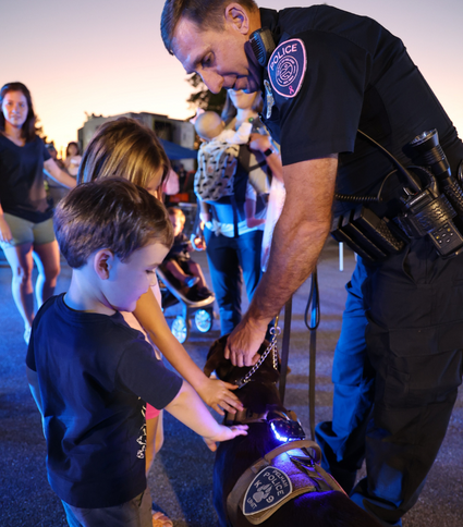 Children petting K-9 Officer Ripley