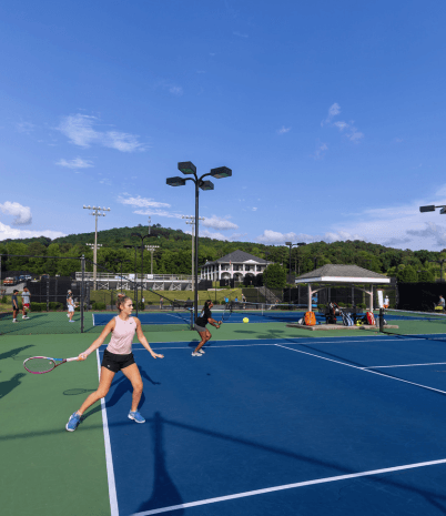 Teenagers playing tennis