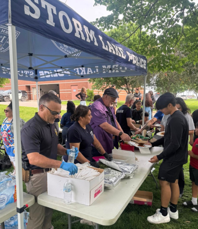 Photo shows members of the Pelham Police Department at a multicultural event in Storm Lake, Iowa.